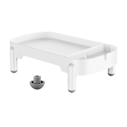 Support rehausseur blanc pour distributeur de croquettes, avec plateau rectangulaire, quatre pieds à embouts gris et pièce de fixation séparée.
